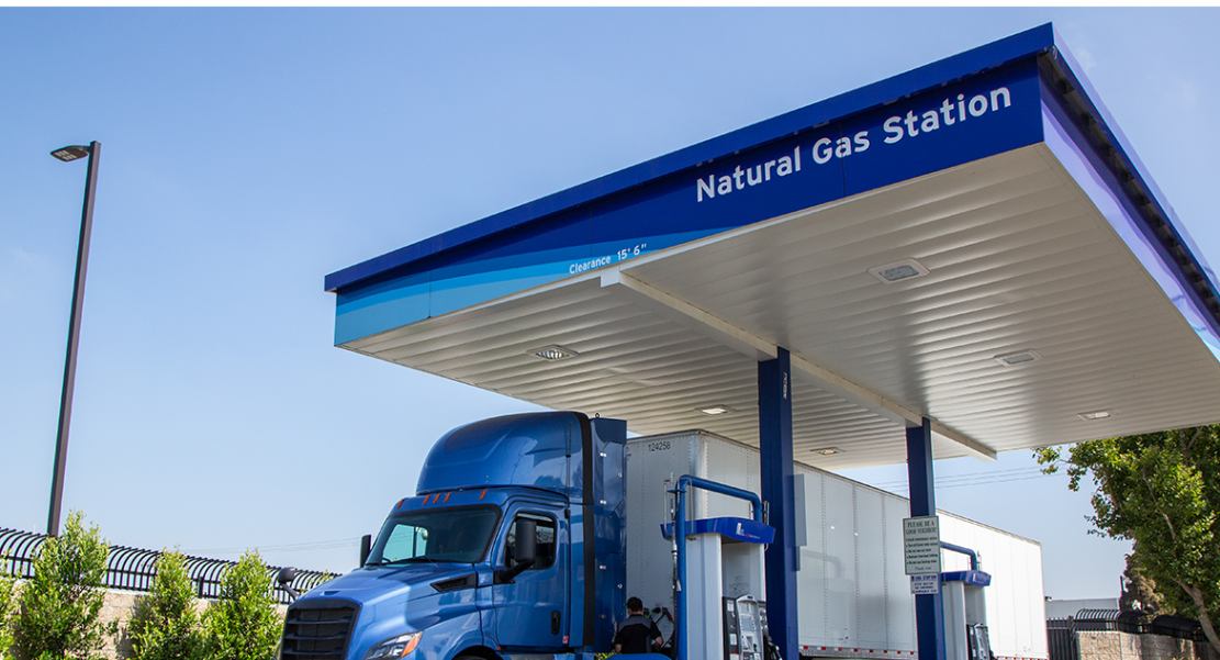 A truck refueling with Compressed Natural Gas (CNG). CNG is a cleaner alternative to traditional diesel fuel.